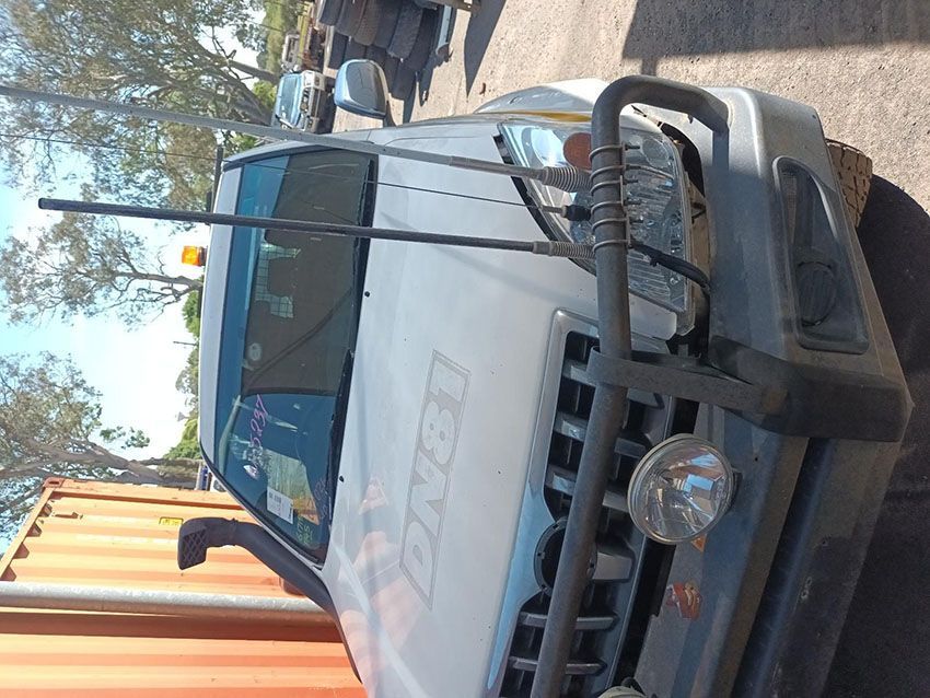 A White Truck is Parked on the Side of the Road — South West 4WD Wreckers In Brisbane, QLD