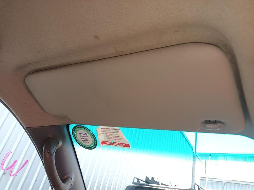 A Sun Visor is Hanging From the Ceiling of a Car — South West 4WD Wreckers In Brisbane, QLD