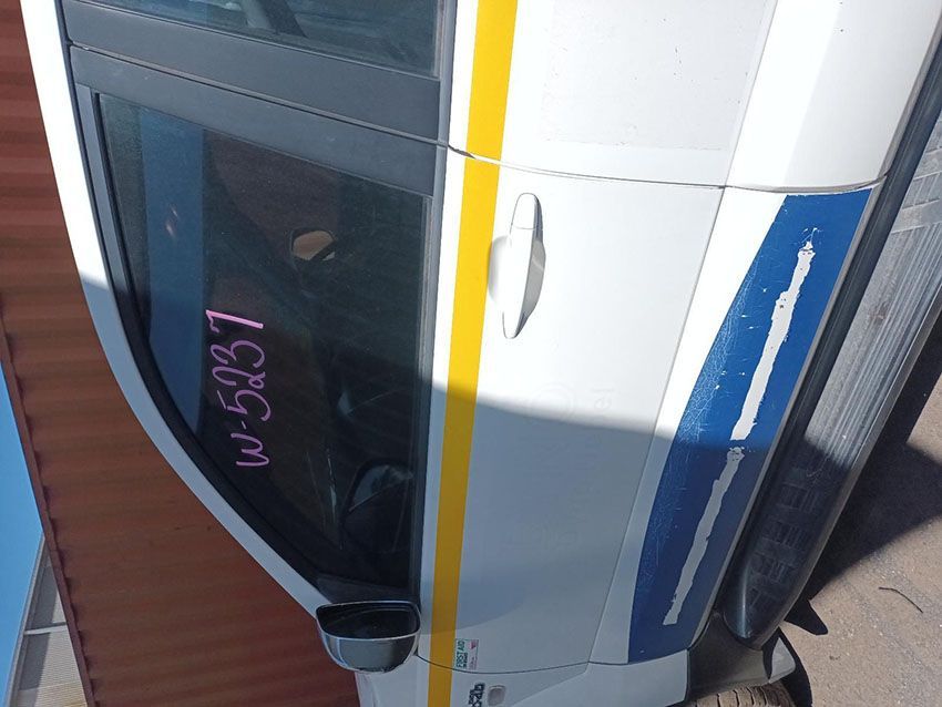 A White Car With a Yellow and Blue Stripe on the Door — South West 4WD Wreckers In Brisbane, QLD
