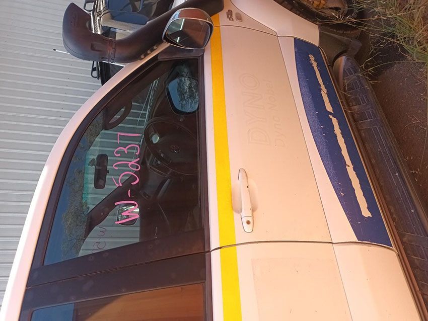 A White Car With a Yellow and Blue Stripe on the Door — South West 4WD Wreckers In Brisbane, QLD
