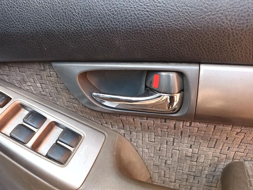 A Car Door Handle With a Red Button on It — South West 4WD Wreckers In Brisbane, QLD