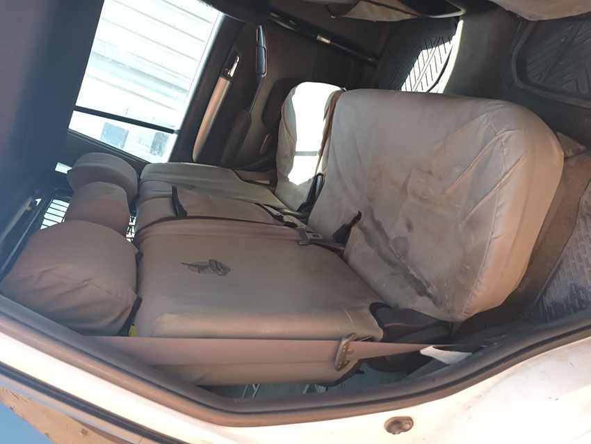 The Back Seat of a White Car With Brown Seat Covers — South West 4WD Wreckers In Brisbane, QLD