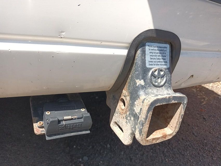 A Close Up of a Trailer Hitch on a White Car — South West 4WD Wreckers In Brisbane, QLD