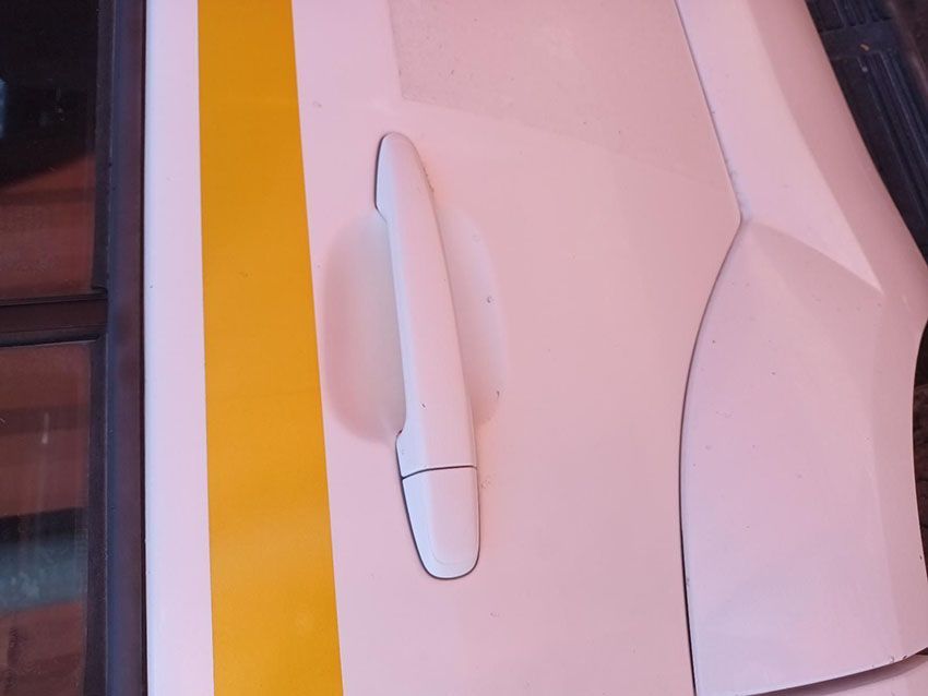 A White Car Door With a Yellow Stripe on It — South West 4WD Wreckers In Brisbane, QLD