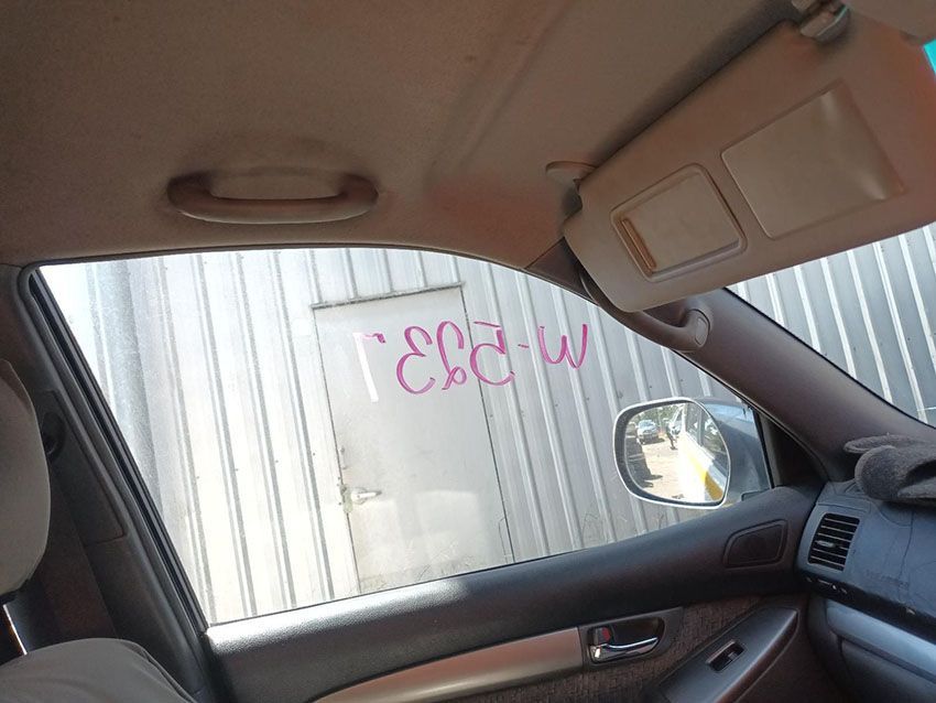 A Car is Parked in Front of a Building That Has the Number 233 on It — South West 4WD Wreckers In Brisbane, QLD