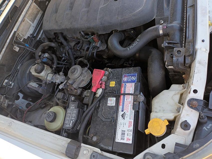 The Engine of a Car With a Battery in It — South West 4WD Wreckers In Brisbane, QLD