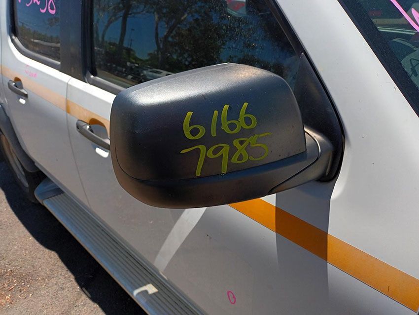 A Side View Mirror on a White Truck Has the Numbers 61166 7985 Written on It — South West 4WD Wreckers In Brisbane, QLD