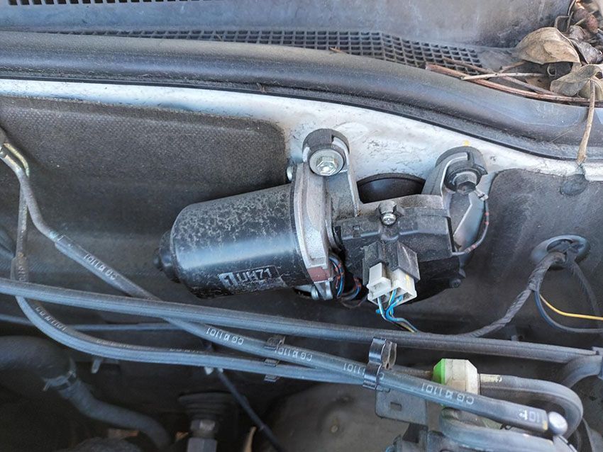 A Wiper Motor is Sitting Under the Hood of a Car — South West 4WD Wreckers In Brisbane, QLD