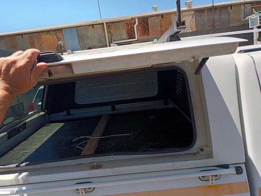 A Person is Opening the Roof of a White Truck — South West 4WD Wreckers In Brisbane, QLD