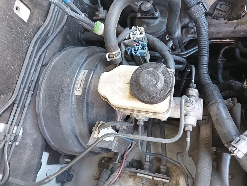 A Close Up of a Car Engine With a Brake Master Cylinder — South West 4WD Wreckers In Brisbane, QLD