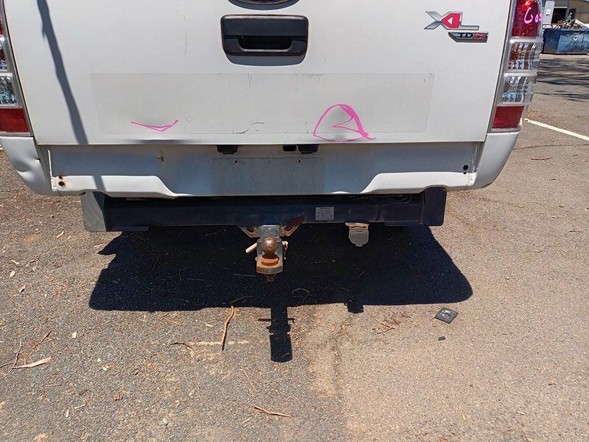 A White Truck is Parked on the Side of the Road — South West 4WD Wreckers In Brisbane, QLD