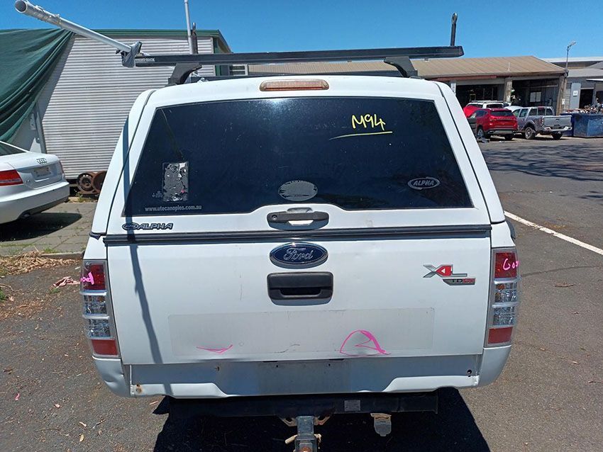 A White Ford Truck is Parked in a Parking Lot — South West 4WD Wreckers In Brisbane, QLD