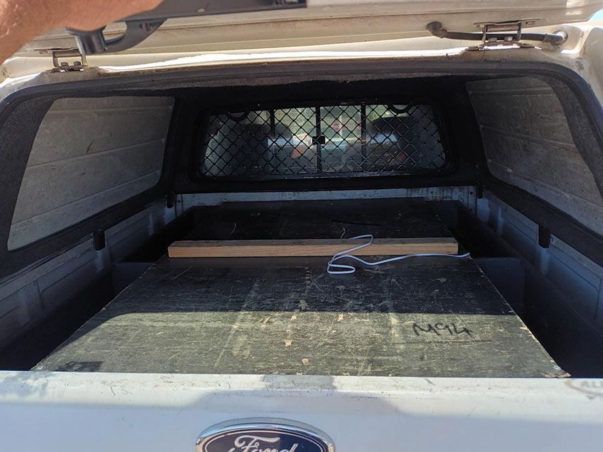 The Back of a White Ford Truck With the Hood Up — South West 4WD Wreckers In Brisbane, QLD