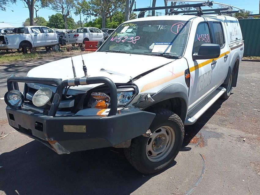 A White Truck With a Black Bumper is Parked in a Parking Lot — South West 4WD Wreckers In Brisbane, QLD