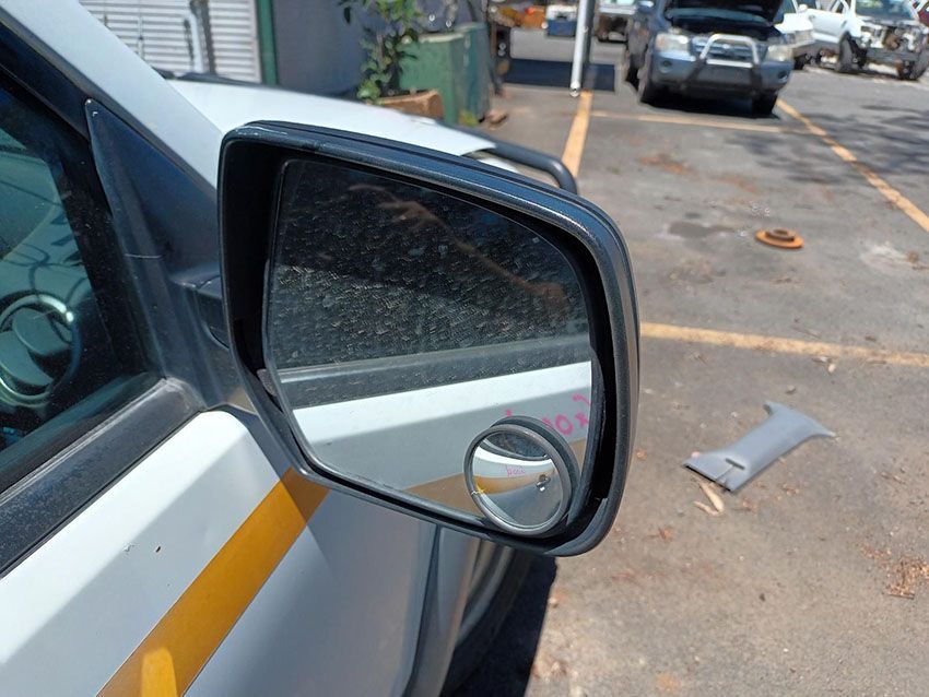 A Close Up of a Car 's Side Mirror in a Parking Lot — South West 4WD Wreckers In Brisbane, QLD