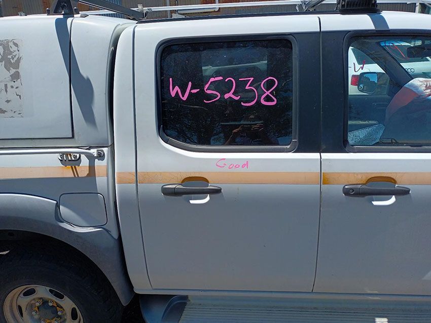 A Gray Truck With the Number W-5238 on the Door — South West 4WD Wreckers In Brisbane, QLD
