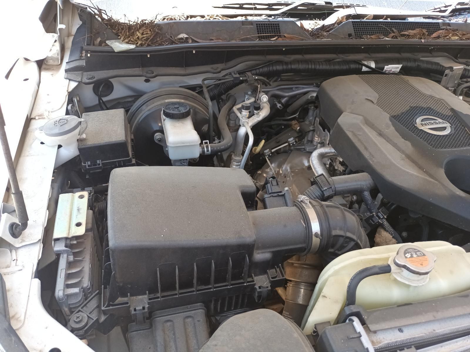 A Close Up of the Engine of a White Car — South West 4WD Wreckers In Brisbane, QLD