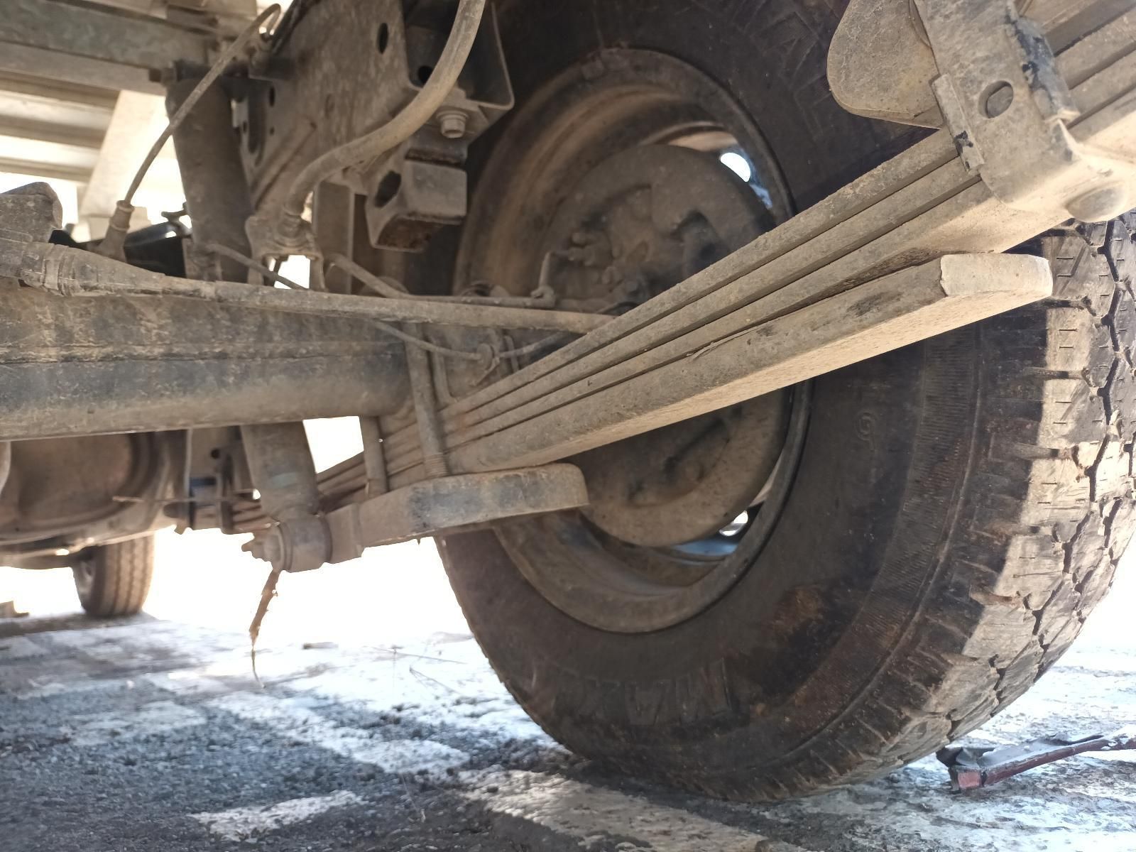 A Close Up of a Tire with a Leaf Spring Attached to It — South West 4WD Wreckers In Brisbane, QLD 