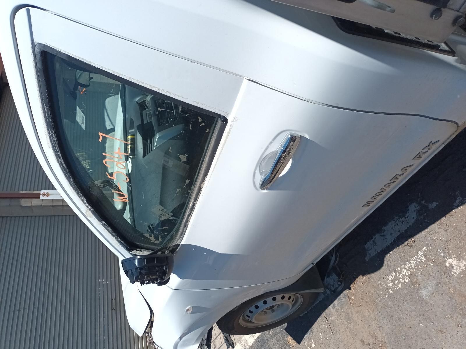 A White Car is Parked on the Side of the Road — South West 4WD Wreckers In Brisbane, QLD