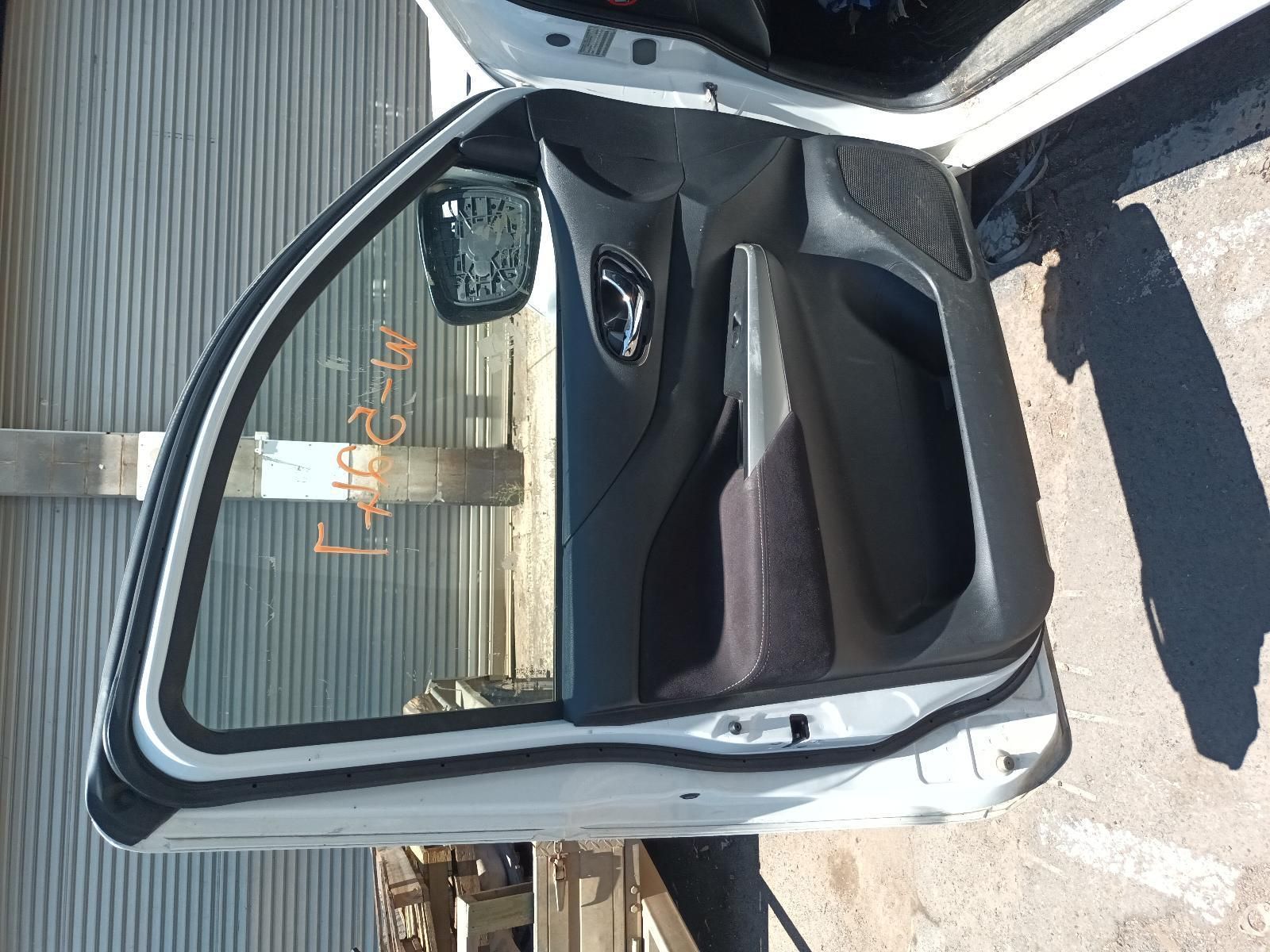 A White Car with the Door Open is Parked in Front of a Building — South West 4WD Wreckers In Brisbane, QLD