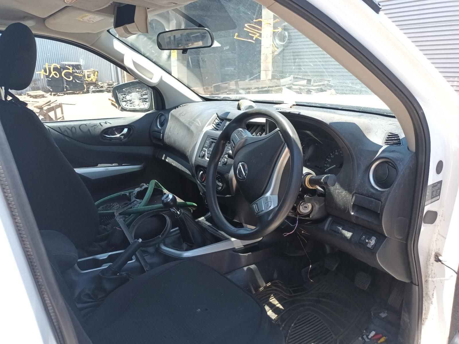 The Interior of a White Truck with a Black Seat and Steering Wheel — South West 4WD Wreckers In Brisbane, QLD