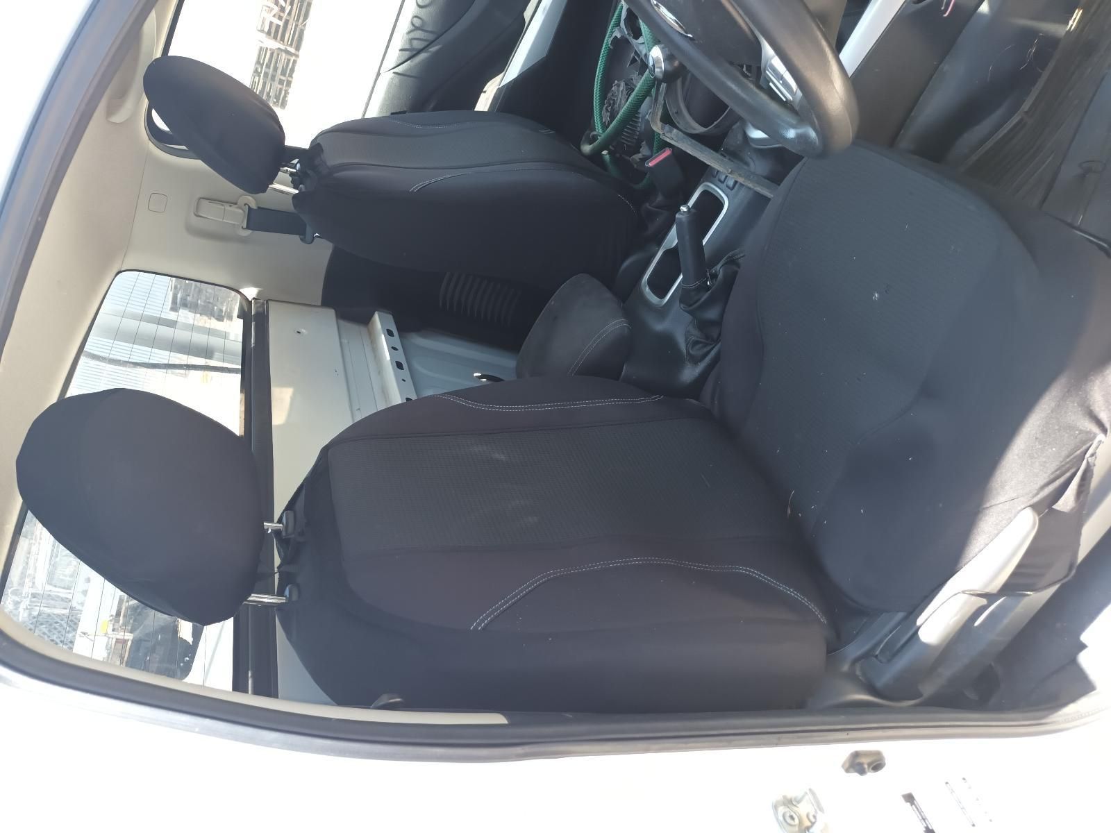 A White Car with Black Seat Covers and a Steering Wheel — South West 4WD Wreckers In Brisbane, QLD