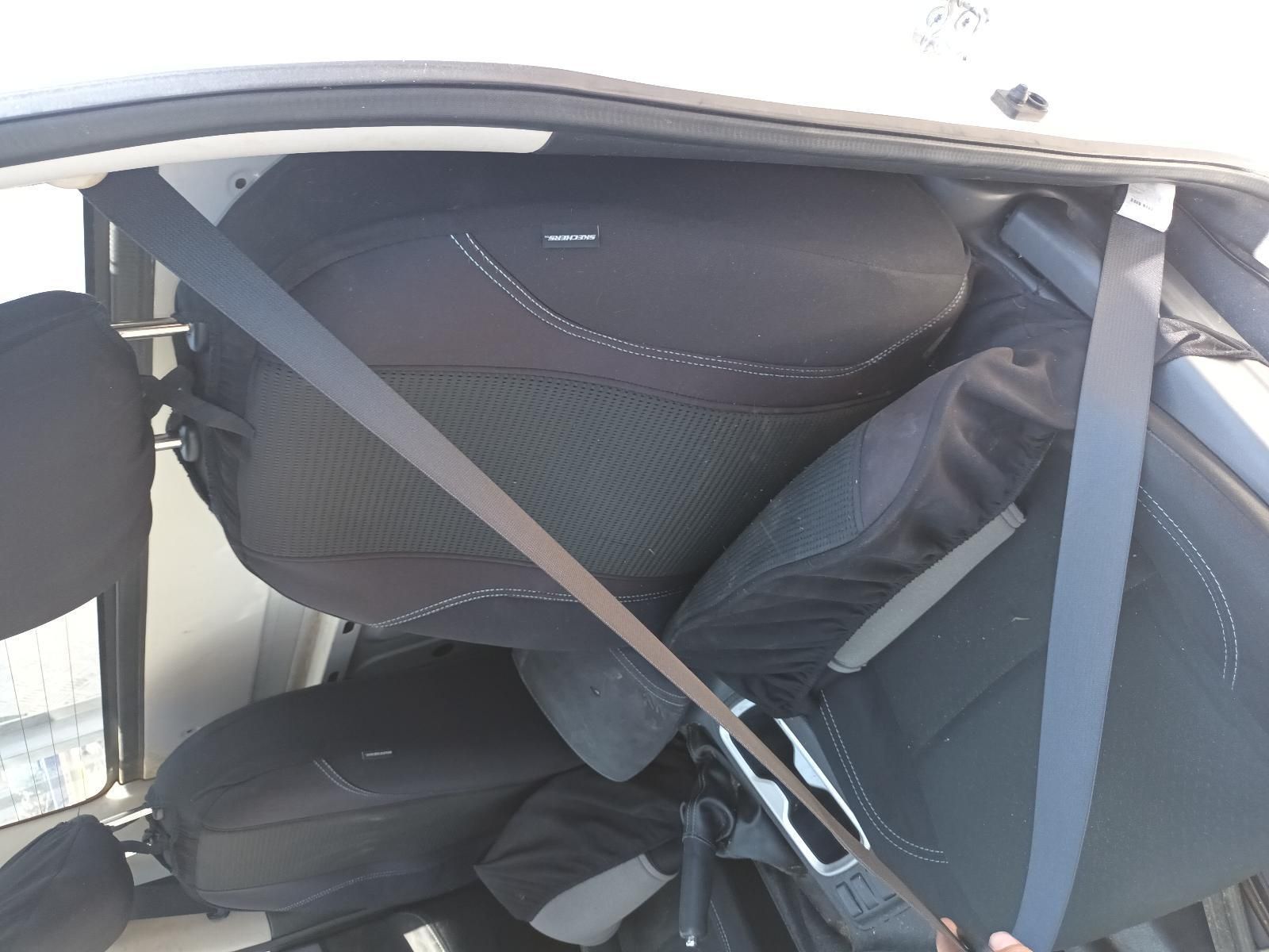 A Person is Holding a Black Bag in the Back Seat of a Car — South West 4WD Wreckers In Brisbane, QLD