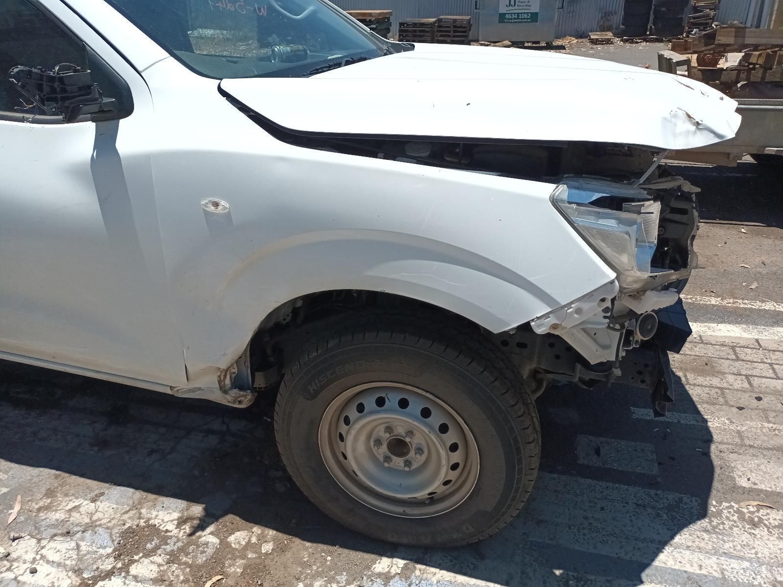 A White Truck with the Hood Up is Parked on the Side of the Road — South West 4WD Wreckers In Brisbane, QLD