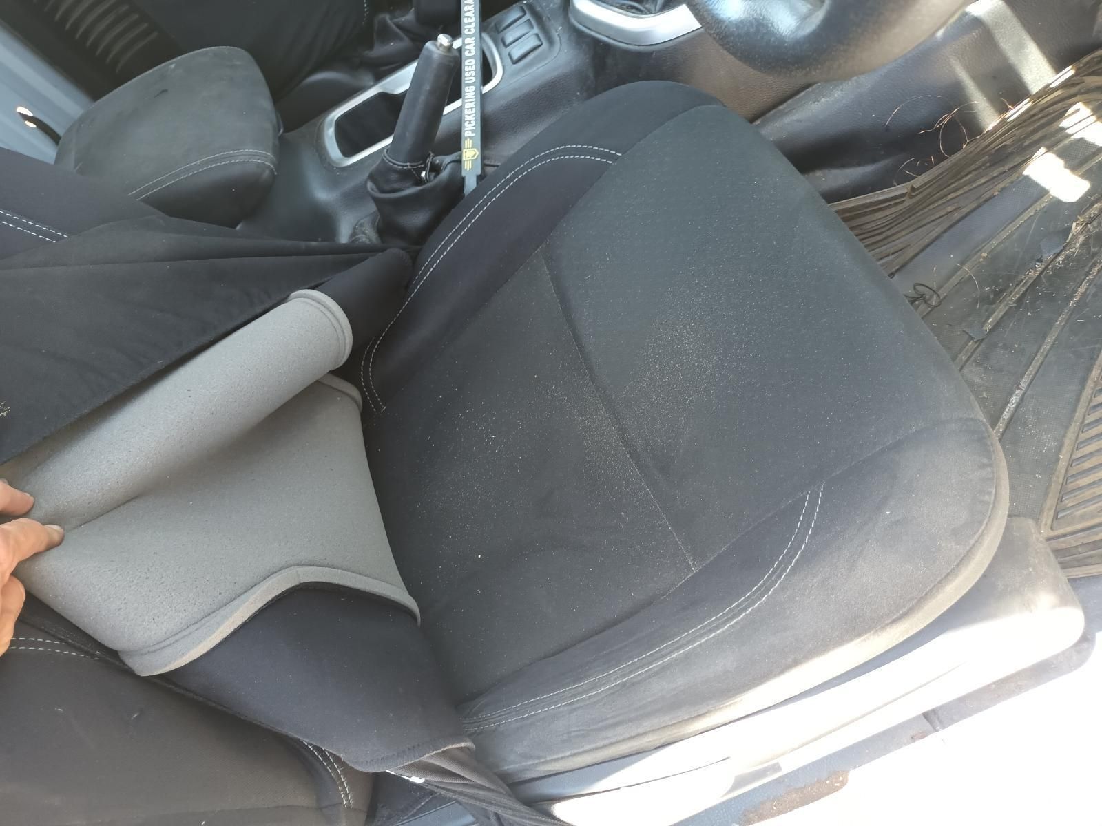 A Person is Cleaning the Seats in a Car — South West 4WD Wreckers In Brisbane, QLD