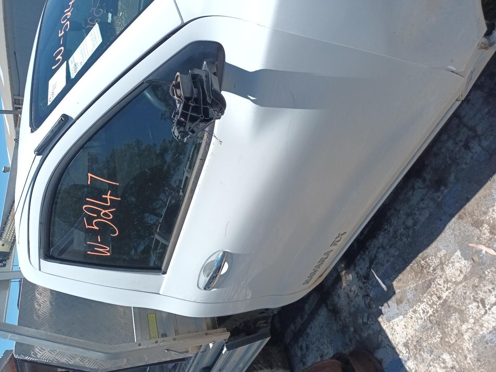 A White Car is Sitting on the Ground — South West 4WD Wreckers In Brisbane, QLD