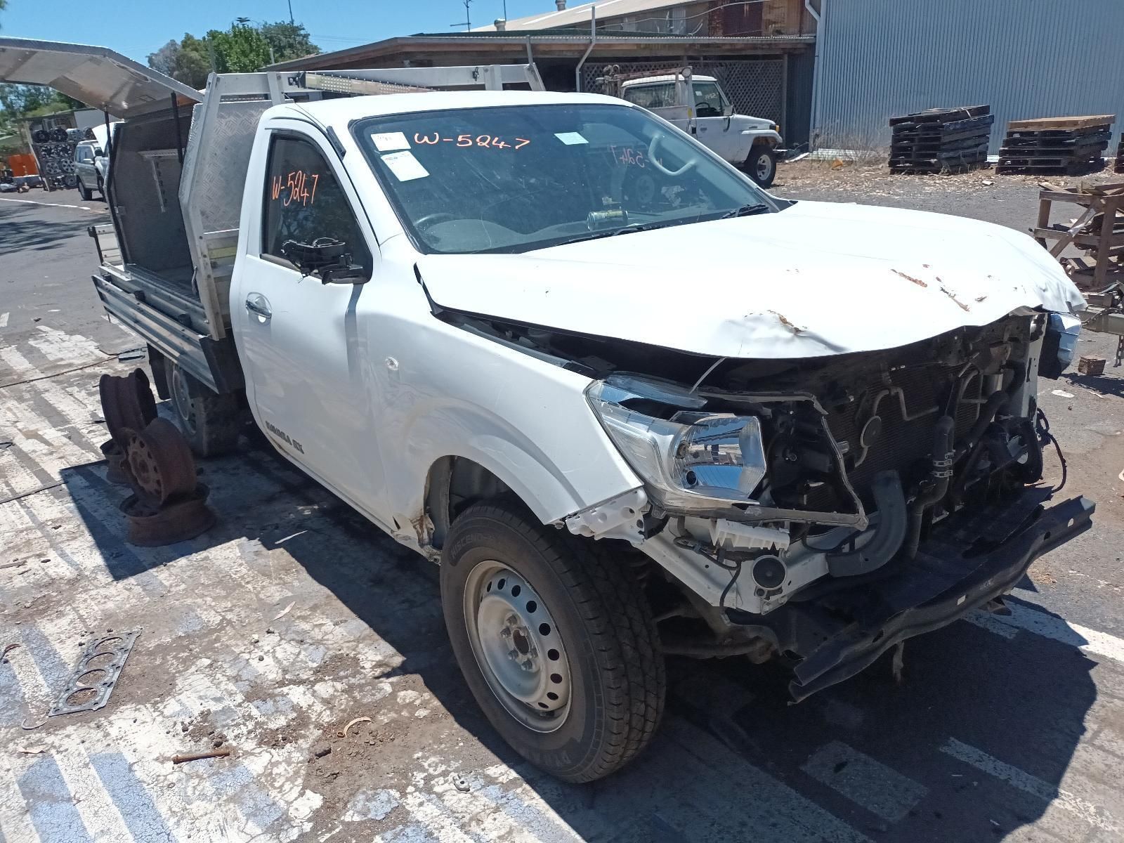 A White Truck is Sitting on the Side of the Road — South West 4WD Wreckers In Brisbane, QLD