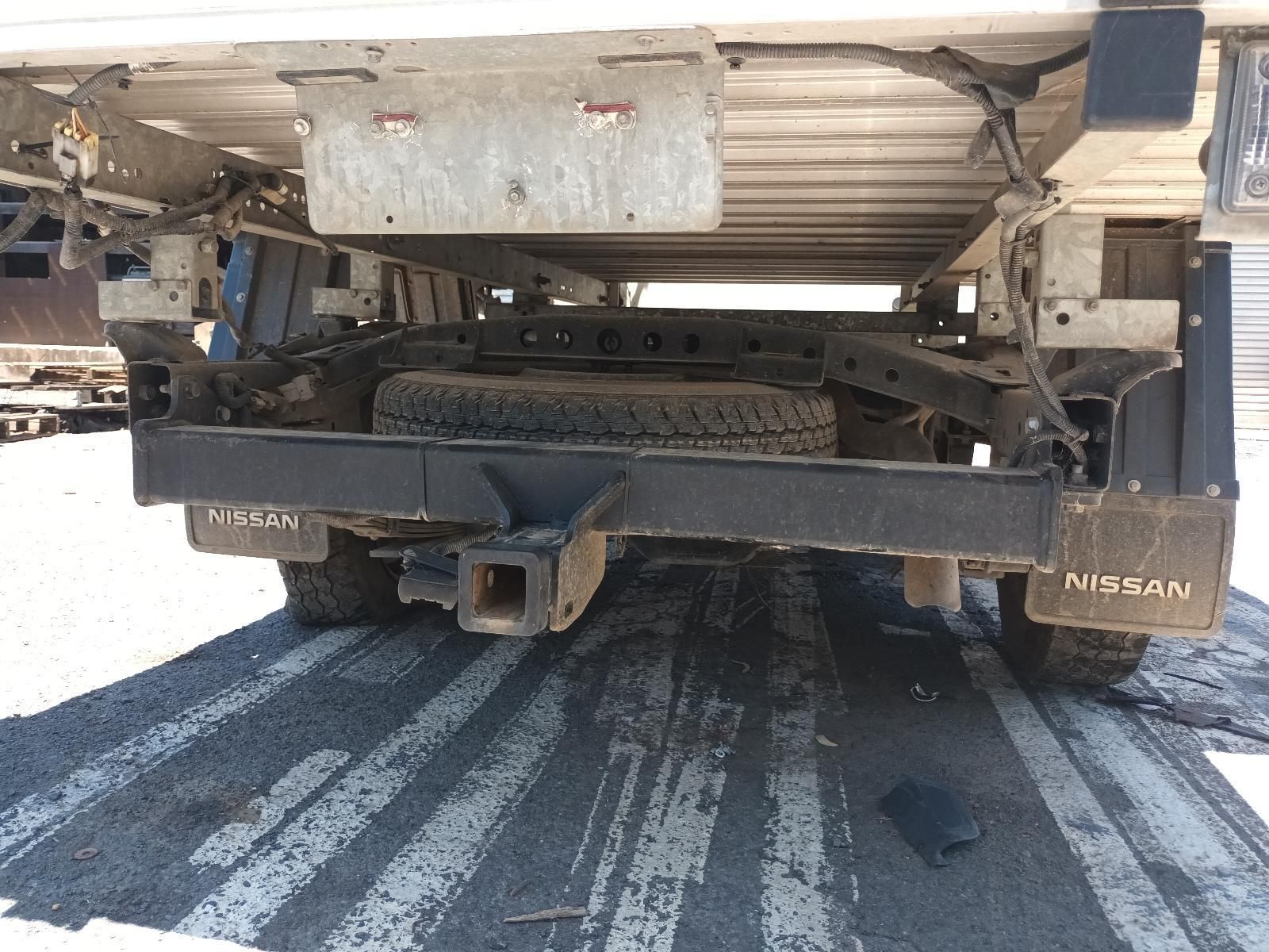 A Nissan Truck is Parked on the Side of the Road — South West 4WD Wreckers In Brisbane, QLD
