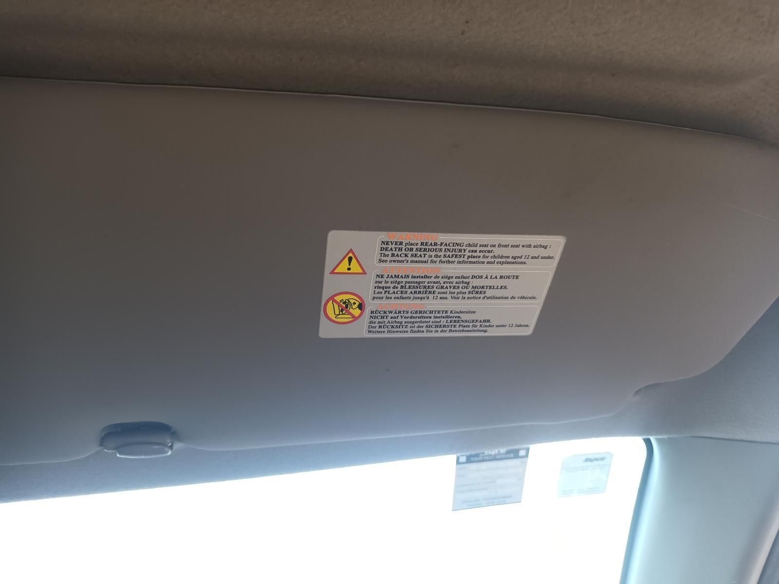 A Car Sun Visor with a Warning Label on It — South West 4WD Wreckers in Harristown, QLD