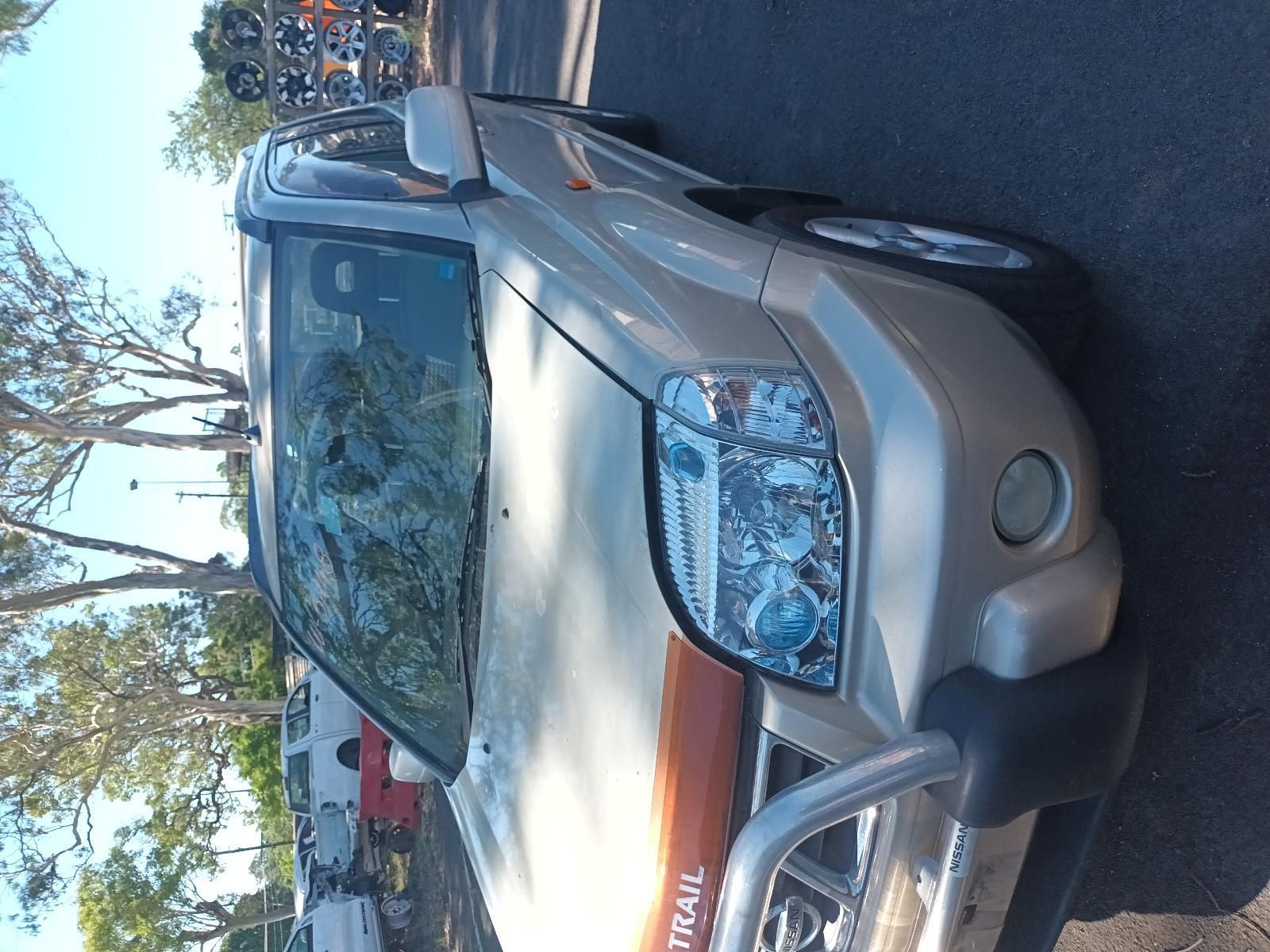 A Silver Nissan X Trail is Parked on the Side of the Road — South West 4WD Wreckers in Harristown, QLD