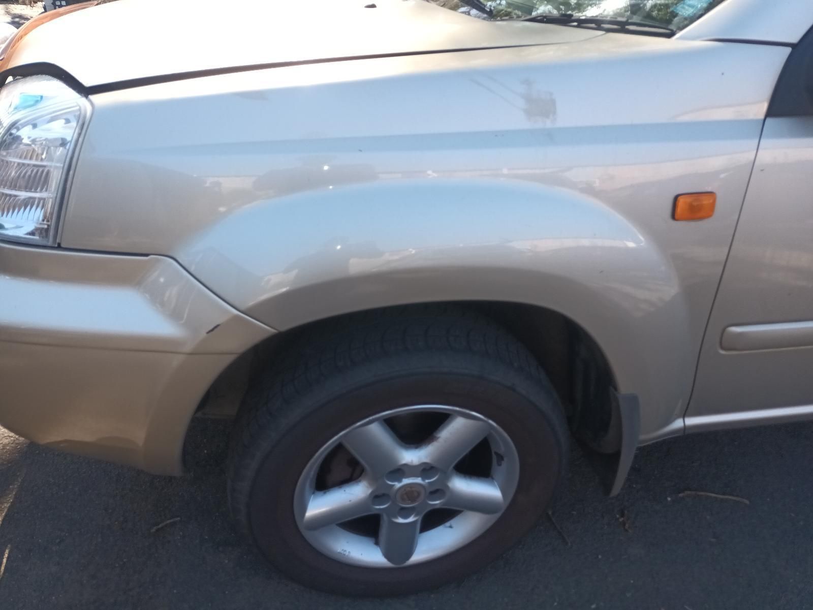 A Silver Car is Parked on the Side of the Road — South West 4WD Wreckers in Harristown, QLD