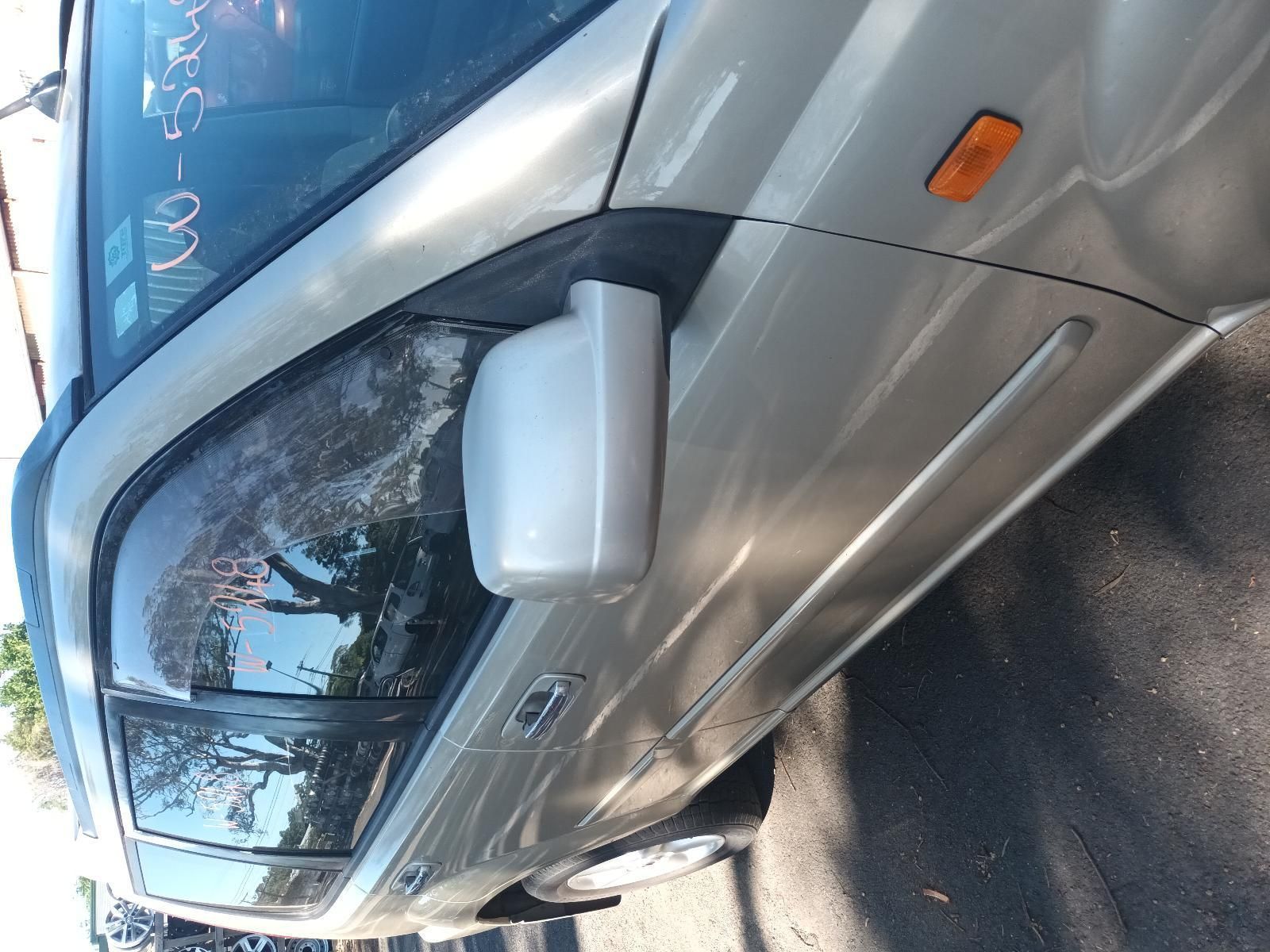 A Silver Car is Parked on the Side of the Road — South West 4WD Wreckers in Harristown, QLD