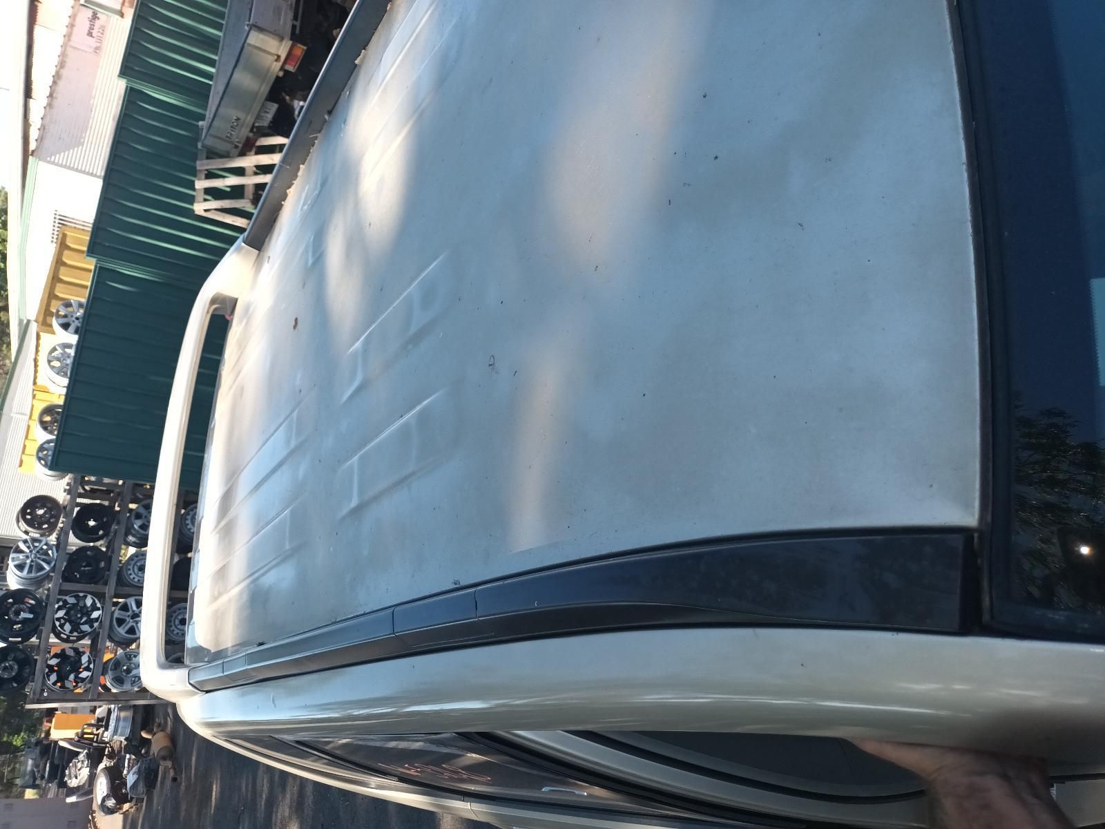 A White Van is Parked on the Side of the Road — South West 4WD Wreckers in Harristown, QLD