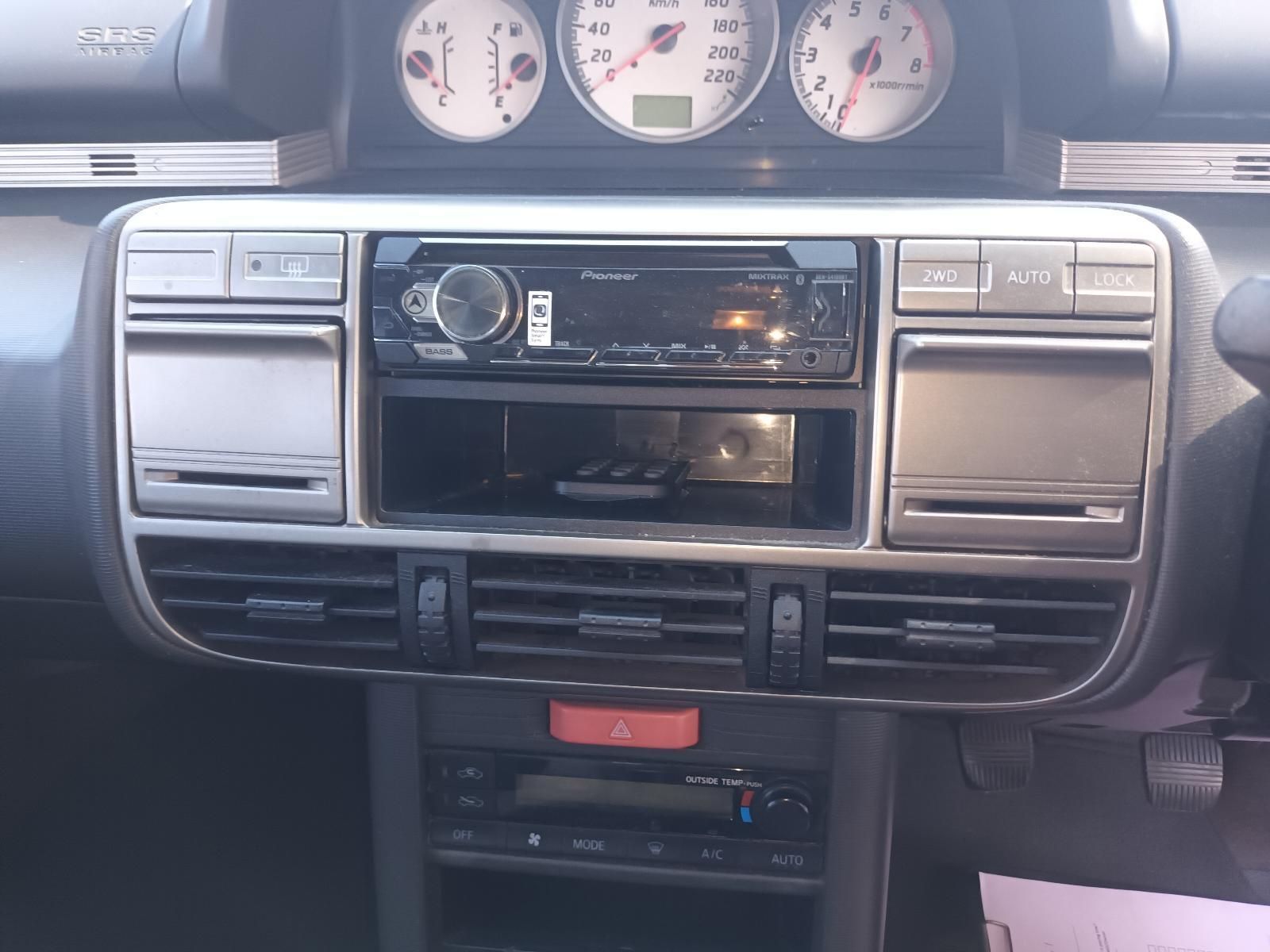 The Dashboard of a Car with a Pioneer Radio — South West 4WD Wreckers in Harristown, QLD