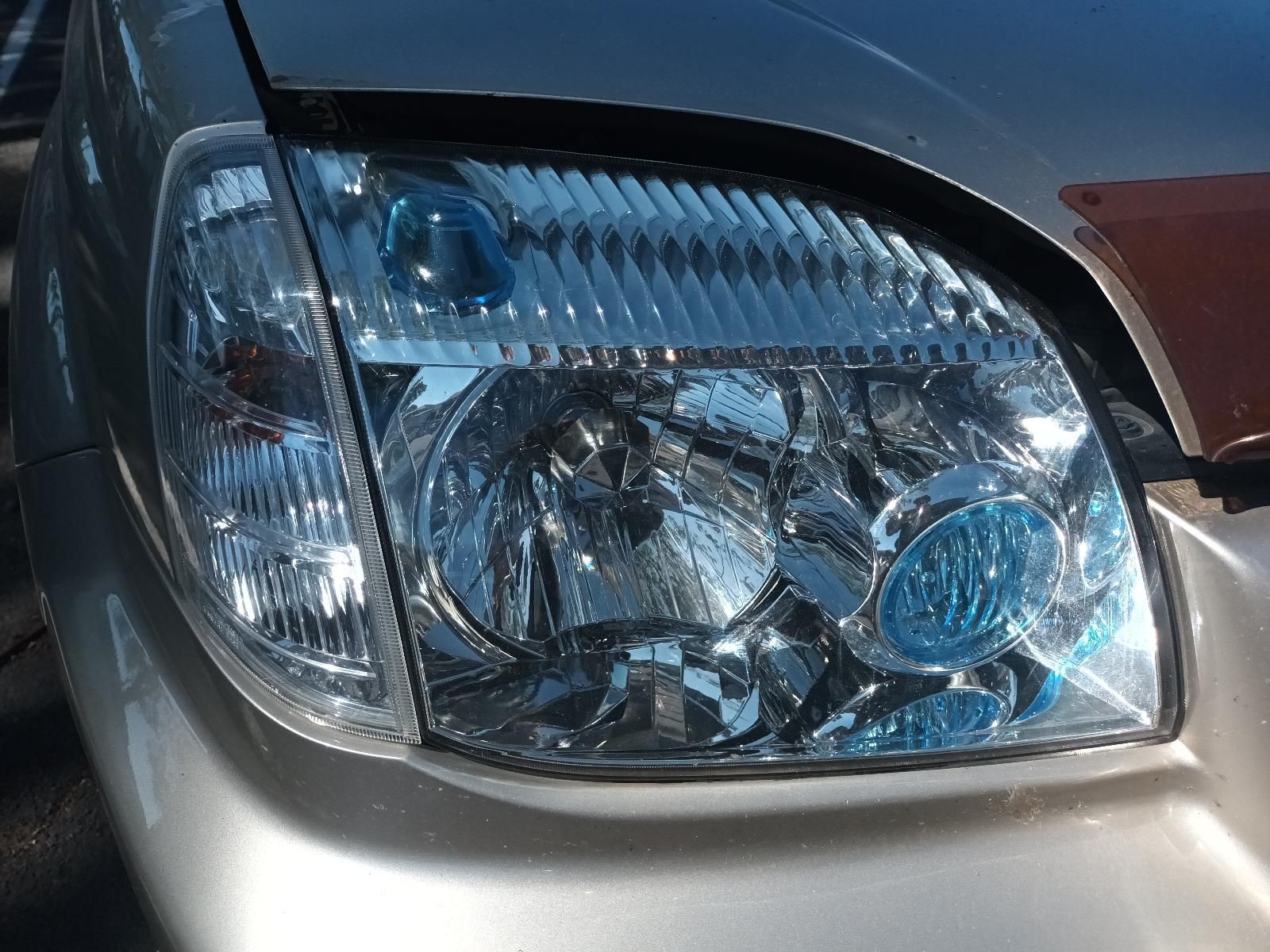 A Close Up of the Headlight of a Silver Car — South West 4WD Wreckers in Harristown, QLD