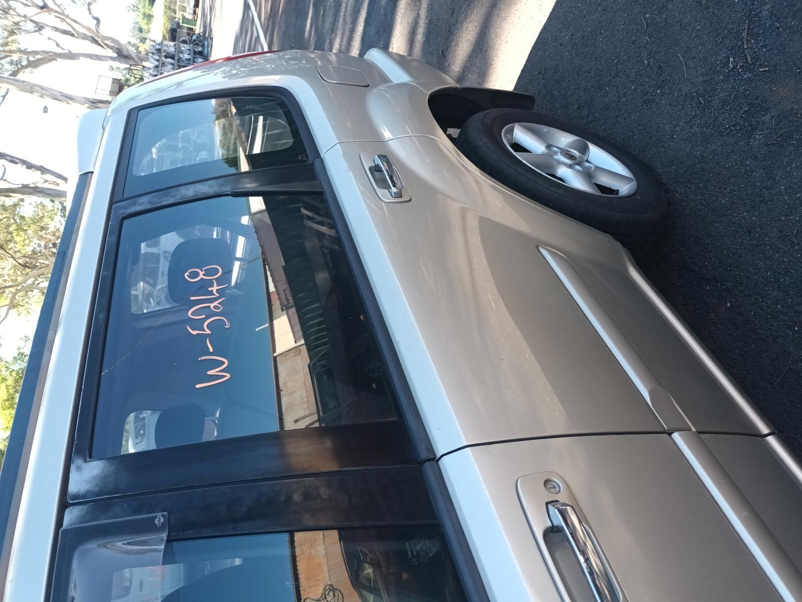 A Car is Parked on the Side of the Road — South West 4WD Wreckers in Harristown, QLD