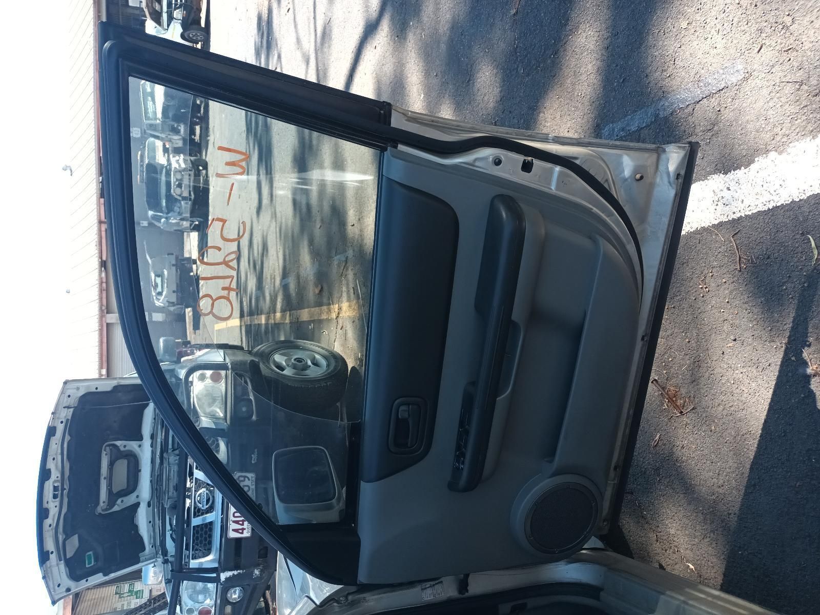 A Car with the Door Open is Parked in a Parking Lot — South West 4WD Wreckers in Harristown, QLD