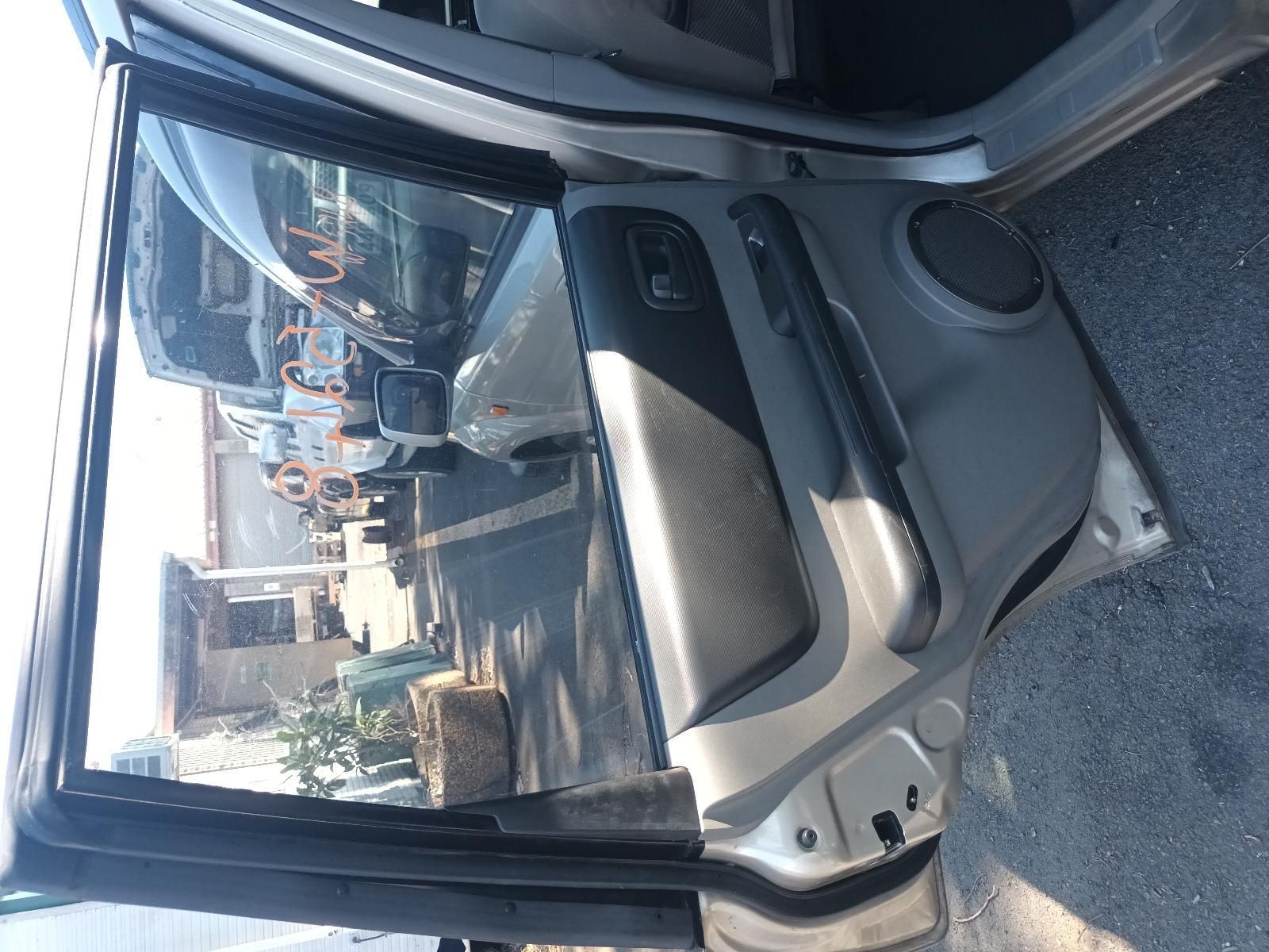 The Back Door of a Silver Car is Open — South West 4WD Wreckers in Harristown, QLD