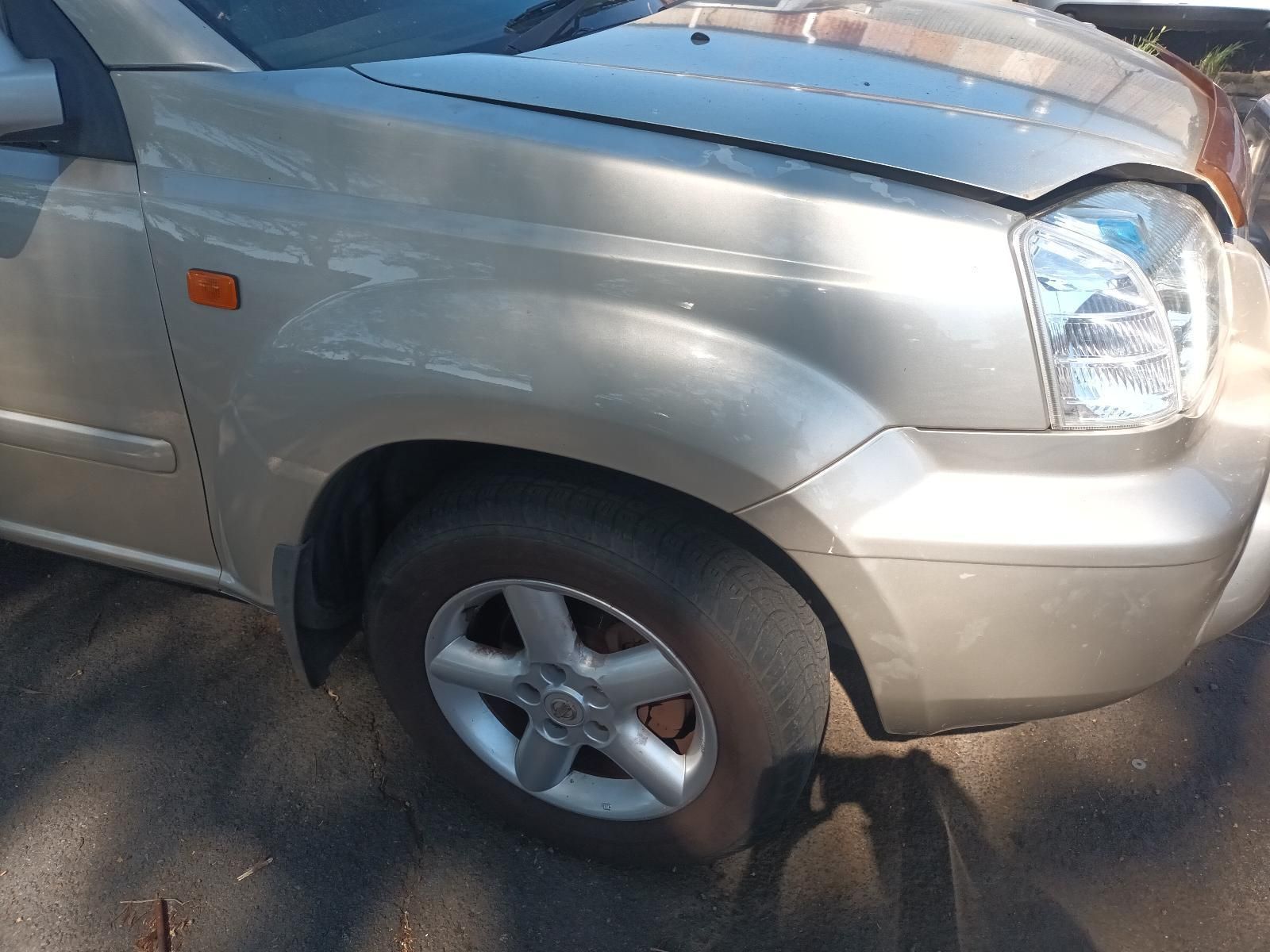 A Silver Car with a Broken Hood is Parked on the Side of the Road — South West 4WD Wreckers in Harristown, QLD