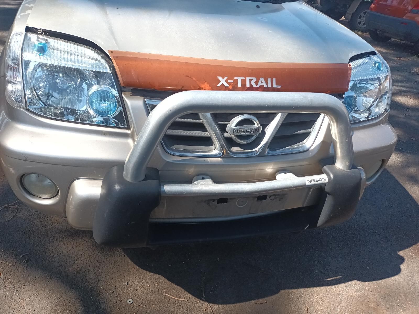 A Silver Nissan X Trail is Parked on the Street — South West 4WD Wreckers in Harristown, QLD