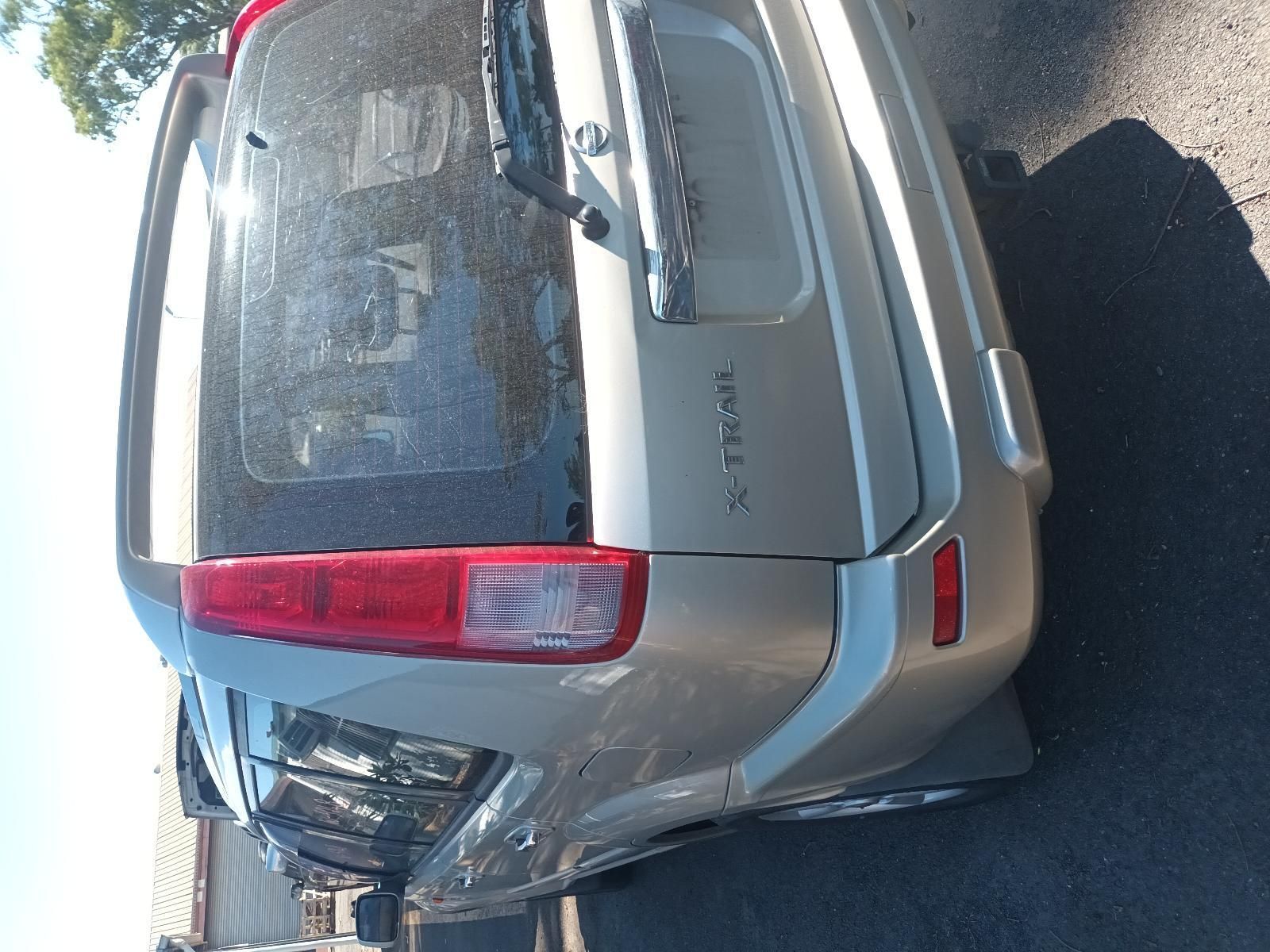 A Silver Nissan X Trail is Parked on the Side of the Road — South West 4WD Wreckers in Harristown, QLD