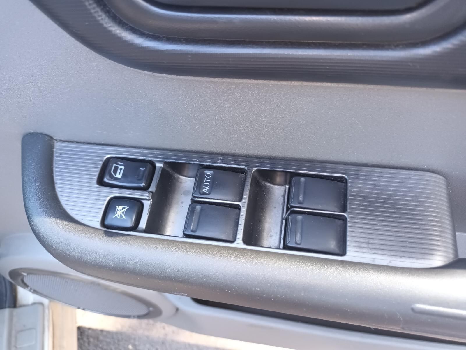 A Close Up of a Car Door Control Panel with Buttons on It — South West 4WD Wreckers in Harristown, QLD