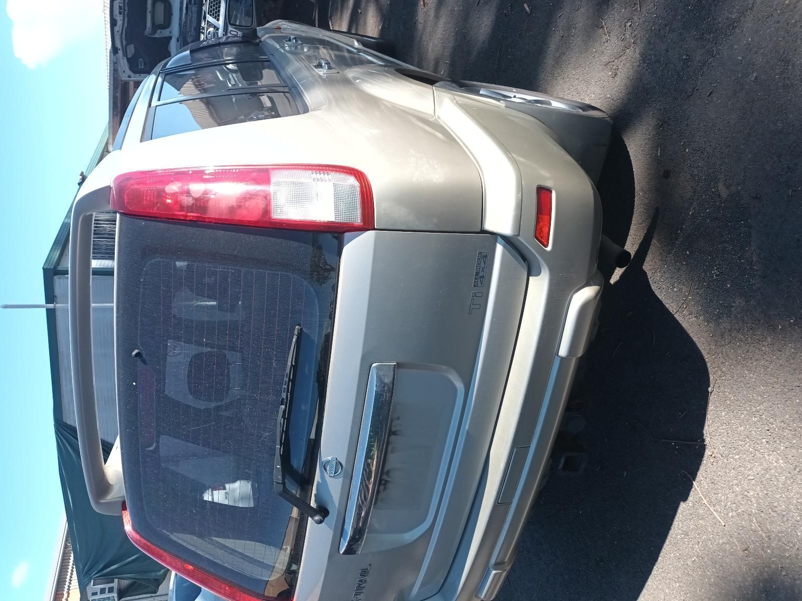 A Silver Nissan Rogue is Parked on the Side of the Road — South West 4WD Wreckers in Harristown, QLD