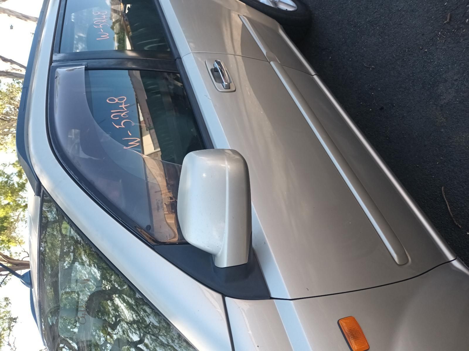 A Silver Car is Parked on the Side of the Road — South West 4WD Wreckers in Harristown, QLD