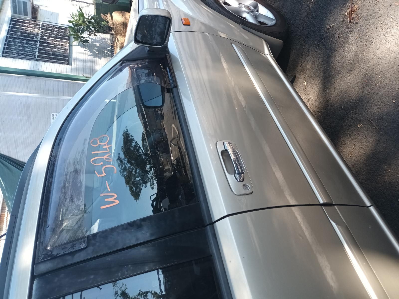 A Silver Car is Parked on the Side of the Road — South West 4WD Wreckers in Harristown, QLD
