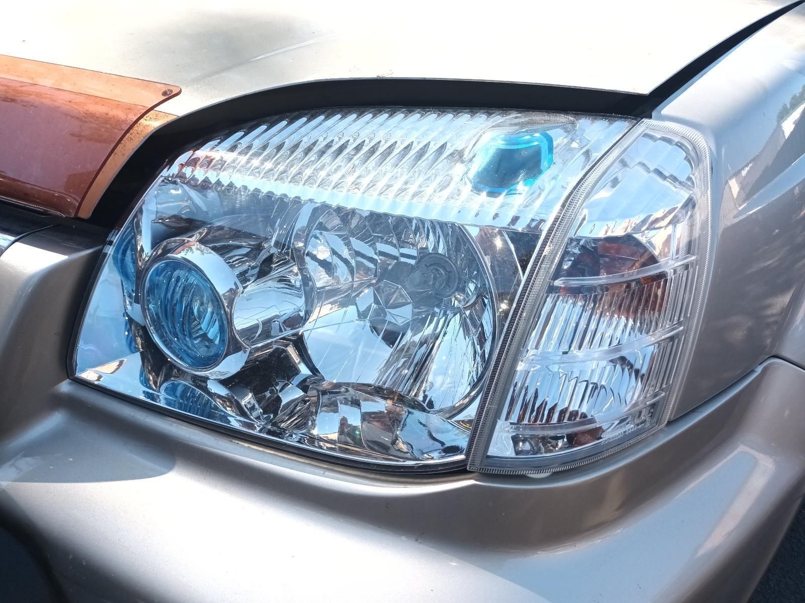 A Close Up of the Headlight of a Silver Car — South West 4WD Wreckers in Harristown, QLD